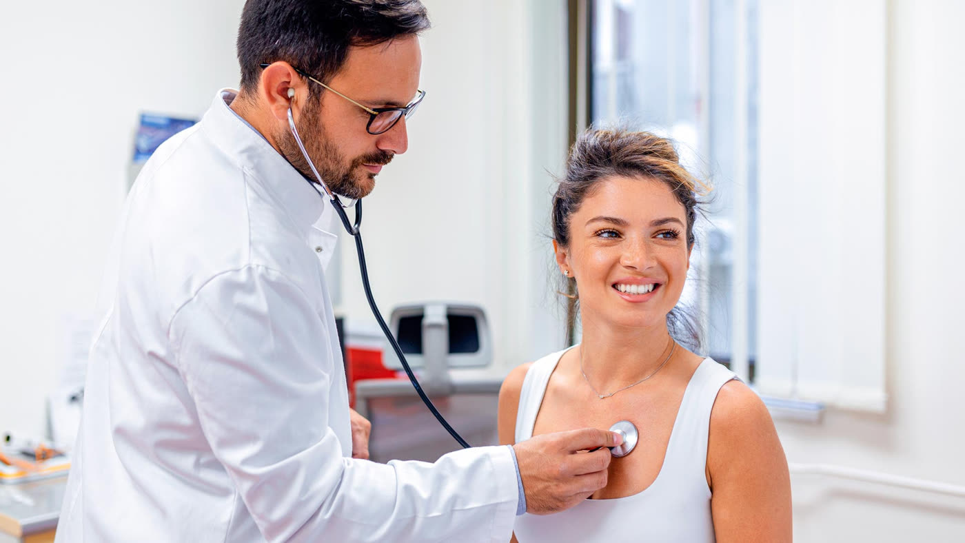 Doctor attending to a patient during a consultation
